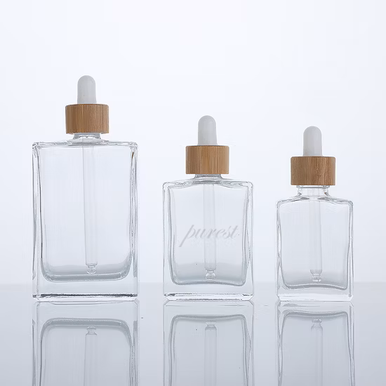 Botella cosmética de vidrio plano cuadrado de 30 ml con cuentagotas y tapa de bambú